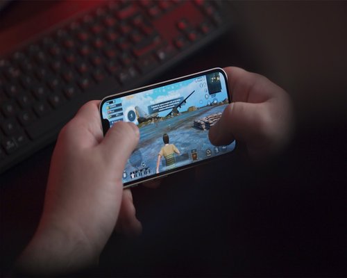 Horizontal smartphone displaying the fictional Skyline Celebration Puzzle game